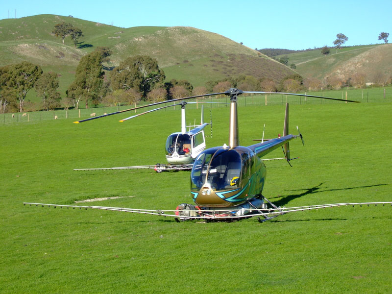 county helicopters parked in field