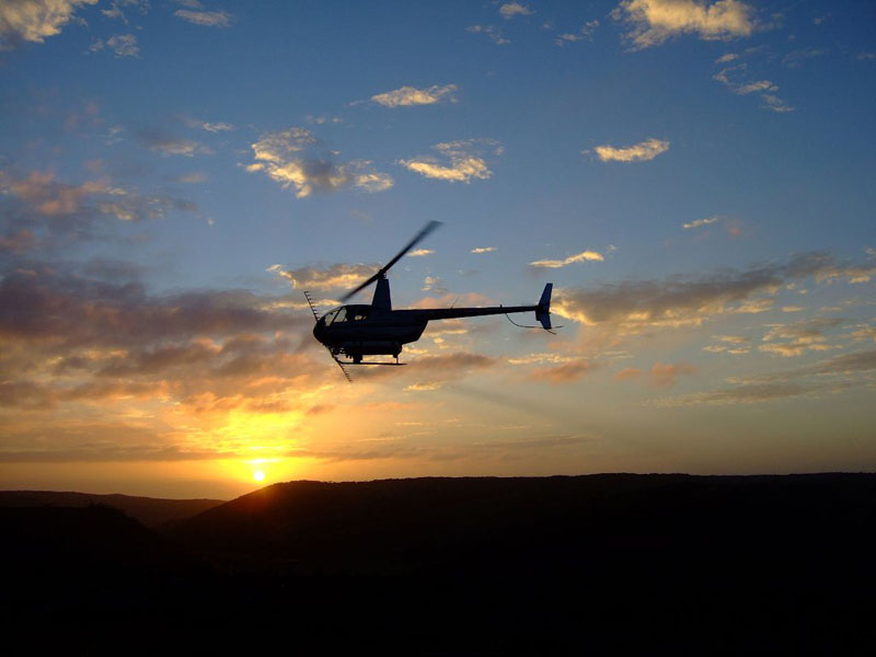 sunset behind helicopter