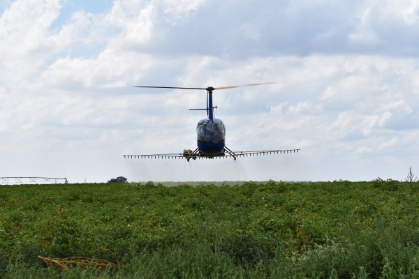 county helicopters aerial crop spraying in helicopter 5